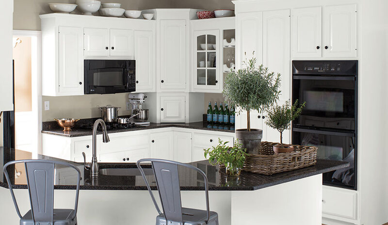 A before and after of the same kitchen features an all-white makeover using ADVANCE® Interior Paint.