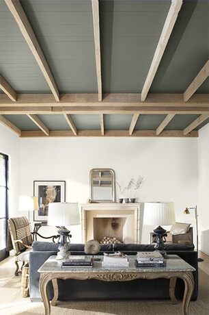 A modern neutral palette living room with high wood paneled ceiling painted in a dramatic gray.