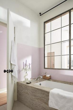 Bathroom with purple-painted wainscoting in New Age, upper walls painted in White Heron.
